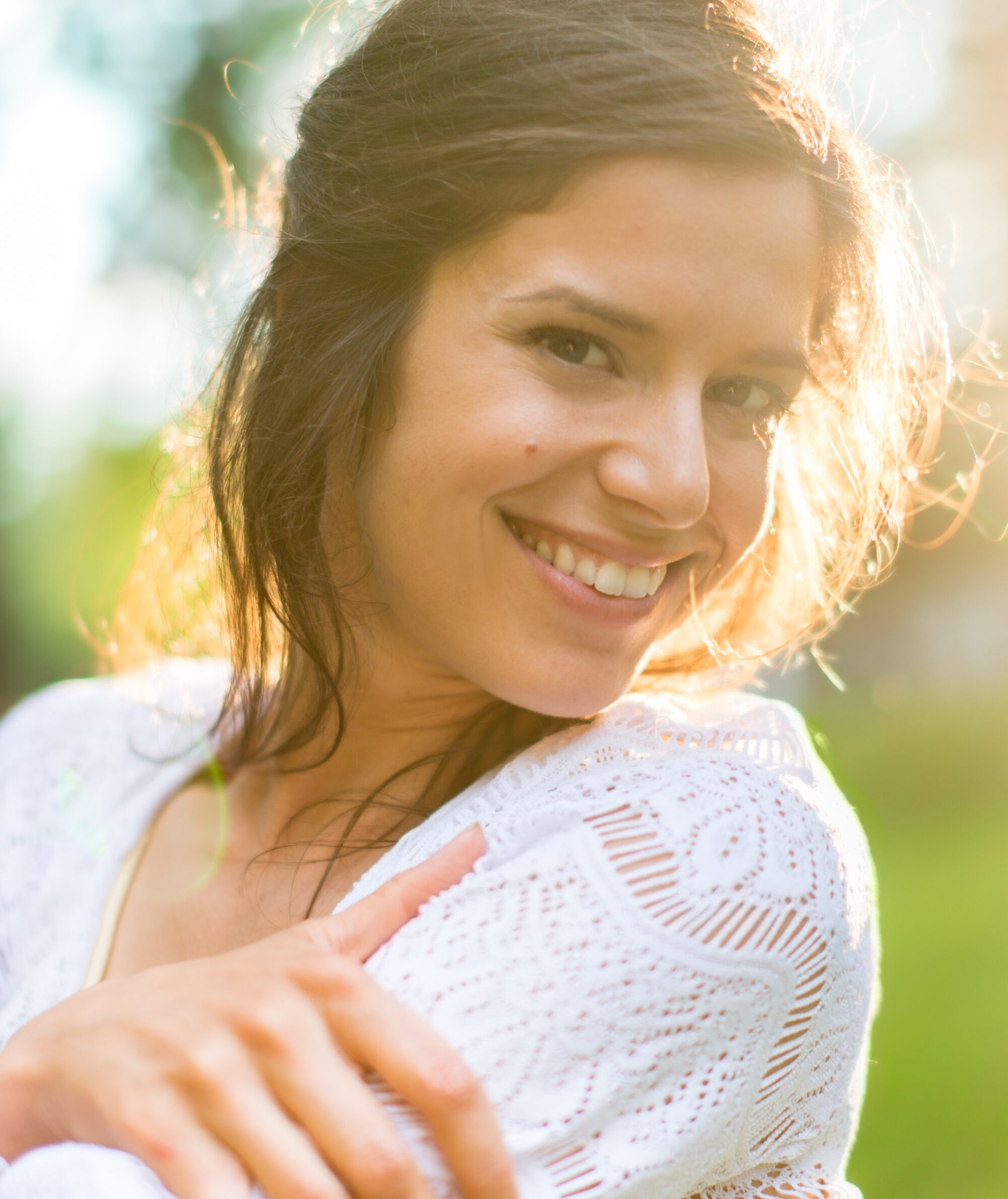 Smiling woman outdoors in natural golden light 2026 01 11 09 55 04 utc